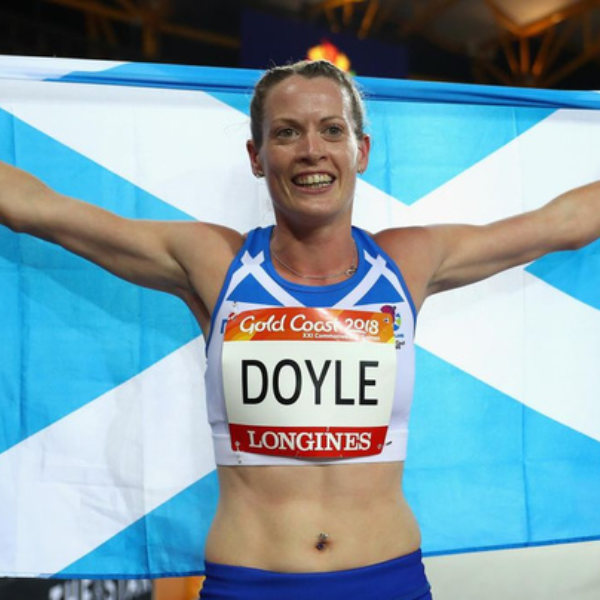 Eilidh Doyle Scottish athlete holding a Scottish flag
